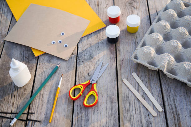 istock Step by step diy process. Step 1- preparation tools for handmade craft a honey bee toy from a cardboard egg tray. Creativity, crafting. Zero waste concept. 1496068129