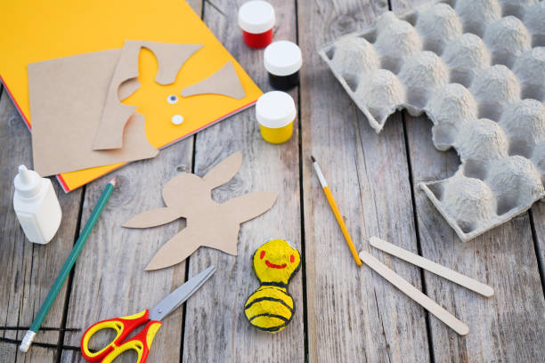 istock Step by step diy process. Step 5- we cut out wings from a sheet of cardboard. Creativity, crafting. Zero waste concept. 1496068209