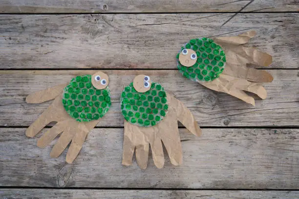 Photo of creating a jellyfish or octopus from bubble wrap and cardboard, with palm prints. What to do with the children. The concept of zero waste.