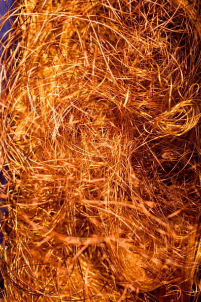 Conductive copper wire used in magnetorquer winding machine to make rod for cubesat satellite in a cleanroom, Cape Town, South Africa.