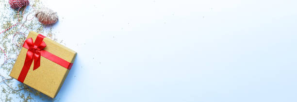 istock Banner Gift wrapping. Christmas present on a blue background. Glitter, shine 1496073692
