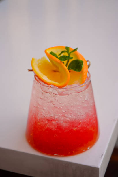 istock Red Ice Cocktail with Orange and Mint Topping 1496074390