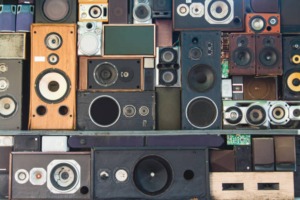 three different stylish retro radio player stands on a white wooden table. near tiles wall