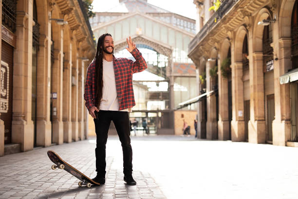 istock Happy smiling skater using the phone 1496075960
