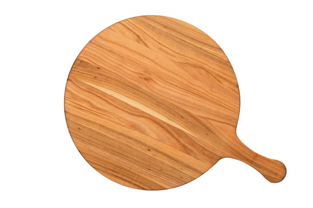 istock Round empty wooden charcuterie serving board with handle. The object is isolated on a white background. View from above. Top view. Template with copy space. Flat lay, mockup. Layout, frame. 1496078282