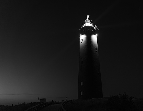 Illuminated lighthouse of Texel in the early morning