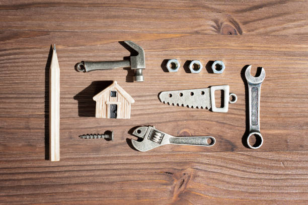 istock Toy House and Tiny Steel Hand Tools and Fasteners Flat-Lay 1496080988