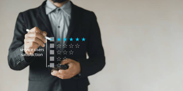 istock Satisfaction concept, Businessman using laptop holding pen finger point at checklist mark ranking of business. feedback, rating, survey, positive, ranking. 1496081254