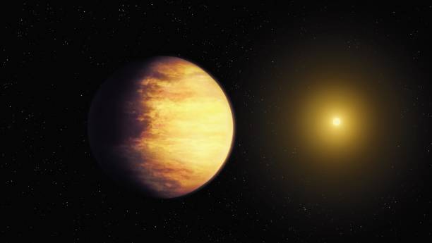 istock Extrasolar planet in yellow tones with a star. 1496083734
