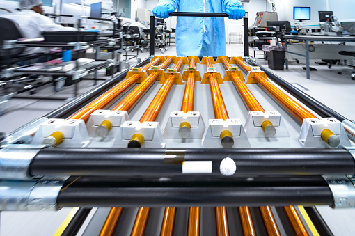 Close-Up Magnetorquer Rods Coils for cubesat satellites pushed blurred motion on an anti-static trolley in cleanroom, Cape Town, South Africa.