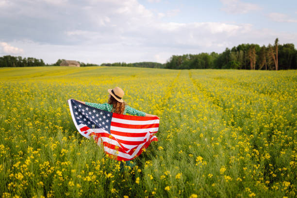 istock Young woman with American flag 1496087162