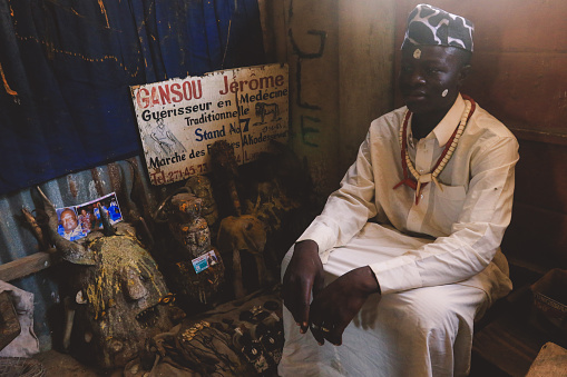 Lome, Togo - April 04, 2023:  Voodoo Priest offering the ritual services in the West Africa