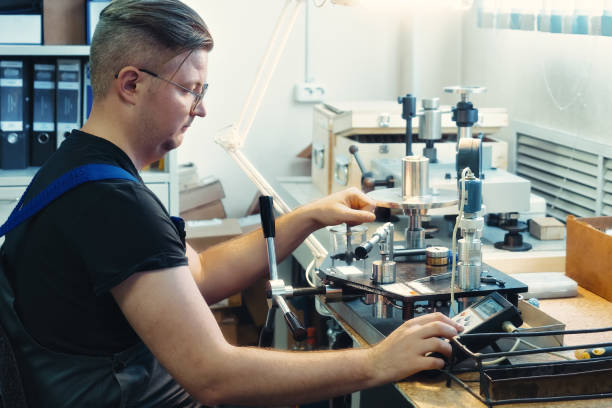 istock Instrumentation fitter performs equipment diagnostics and calibration at his desk 1496090467