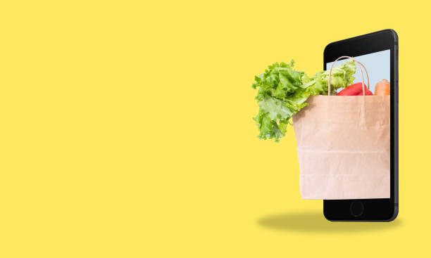 istock Modern art collage cell phone grocery bag on yellow background with space for text. 1496092985