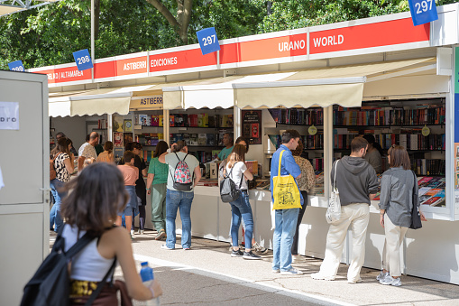 Madrid, Spain. May, 31, 2023. People visiting the Madrid Book Fair 2023 in the Retiro Park. Books, writers and readers. Book day.