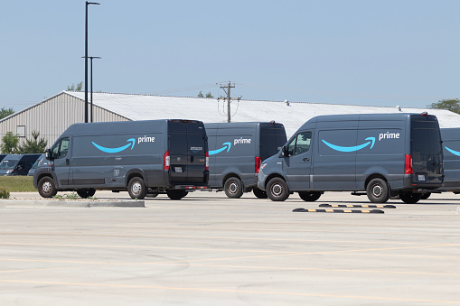 Champaign - Circa June 2023: Amazon Prime delivery van. Amazon.com is in the delivery business With Prime branded vans.