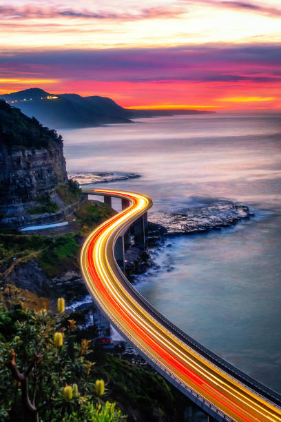 istock Light trail across the Sea Cliff Bridge 1496095923