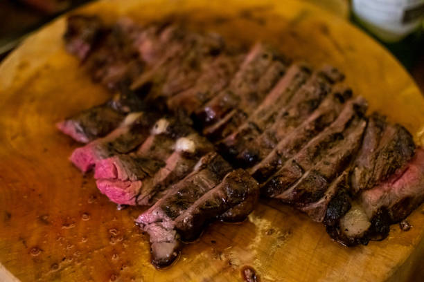 istock Medium rare meat on wooden plate 1496098105
