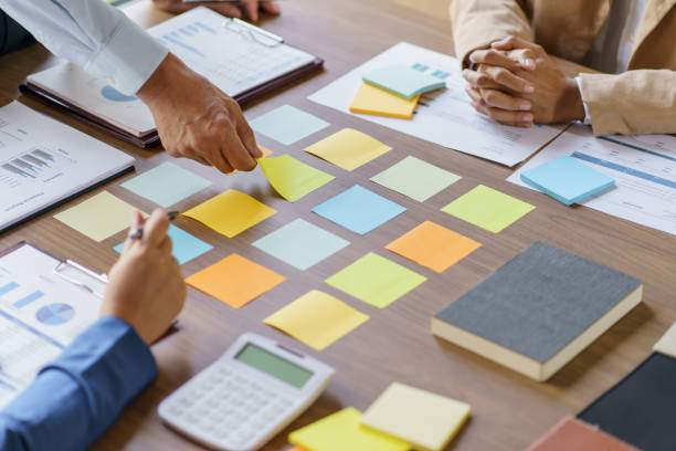istock Business People brainstorming Meeting Design Ideas use post it notes to share idea professional investor start up project business brainstorming planning in office 1496098531