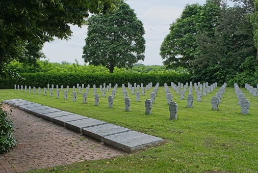 Bohonye, Hungary - Jun 2, 2023: German Second World War cemetery in Bohonye. There are 2080 graves here. Spring cloudy day. Selective focus