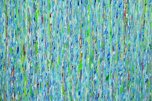 Texture of an oriental blue-blue canvas with an abstract pattern of the water element with green and burgundy splashes, close-up.