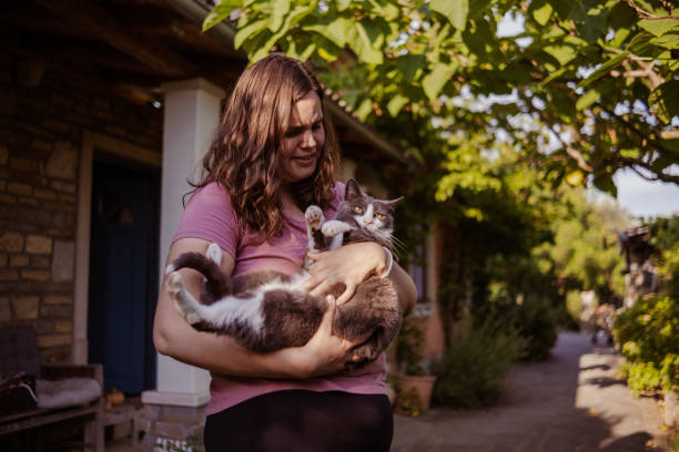 istock Woman and her cute per cat 1496103699