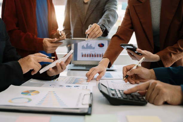 istock Business team present. professional investor working new start up project. tablet laptop computer with digital marketing media  in virtual icon design Finance managers meeting. 1496104232