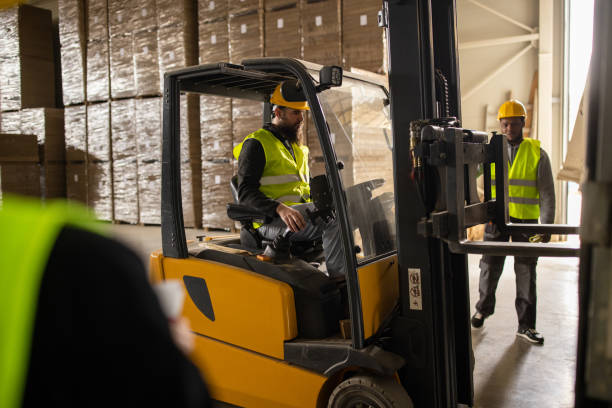 istock Warehouse employees loading up a truck trailer 1496105892