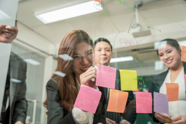 istock Modern Asian businessman with high confidence Committed to working together as a harmonious team Having a professional planning meeting at the company 1496109315