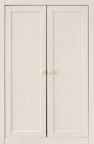 istock Wooden wardrobe cabinet doors with white handles 1496111629