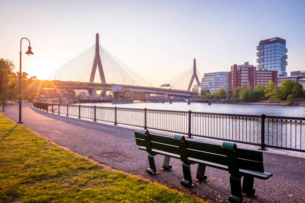 The city of Boston at Backbay Boston, MA, USA - June 1, 2023: view of the city of Boston in MA, USA at sunrise showcasing the architecture of the Backbay neighborhood with the Zakim bridge and the Charles river at sunrise. boston prudential building stock pictures, royalty-free photos & images