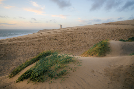 Scenic view of Rubjerg Knude lighthouse in sandstorm in summer