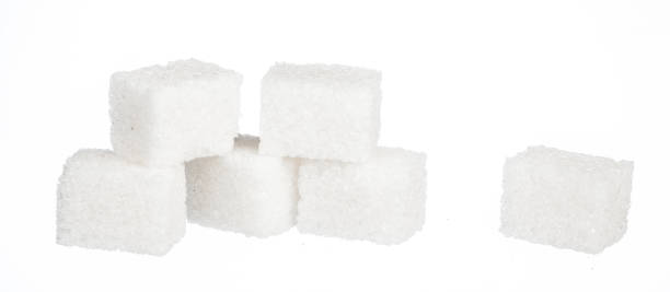 istock Cubes of sugar isolated on white background 1496114673