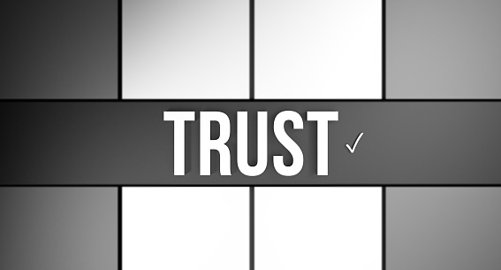 TRUST word text business concept. Trust with a checkmark on a gray dark-light background. Cooperation, trust and partnership in business, concept banner. 3D render.