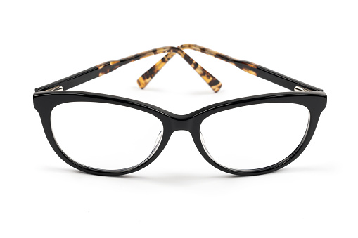 Glasses with black and tortoiseshell frames isolated on a white background