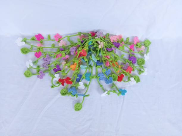 istock Crochet necklace flowers multicoloured butterfly pattern handmade background texture 1496115588
