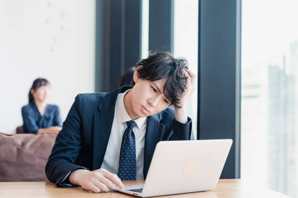 istock A businessman in distress in his office 1496115594