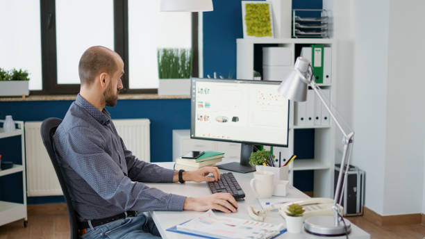 istock Company employee working with sales statistics on charts 1496116936