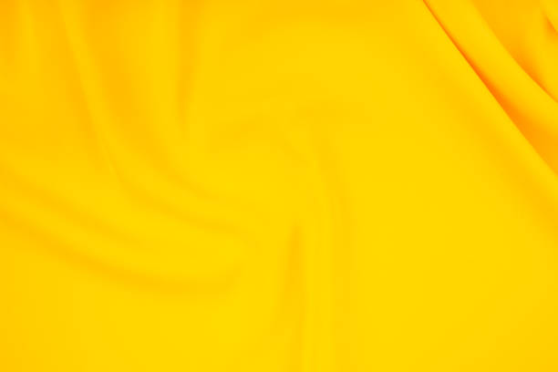 Abstract textured wavy background in yellow colors.