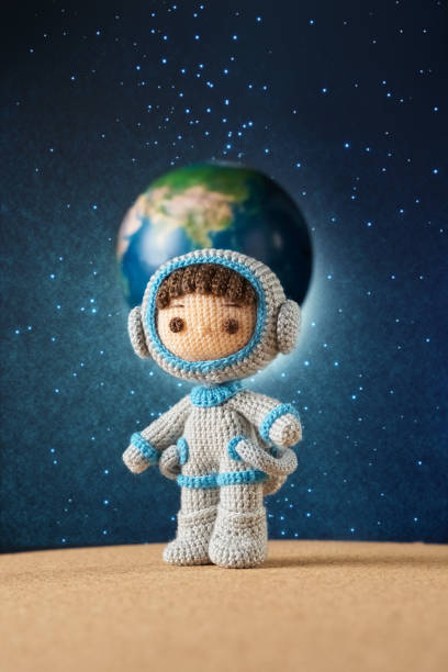 istock Small and cute Amigurumi doll .　astronaut in outer space 1496117860