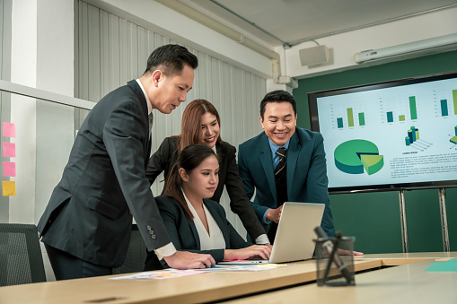 Modern Asian businessman with high confidence Committed to working together as a harmonious team Having a professional planning meeting at the company