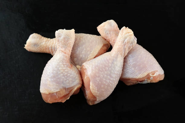 istock Raw Chicken Leg Quarters on  Stone Plate 1496120320