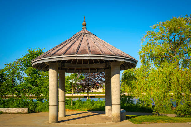 istock Park pavilion at lakeside in springtime 1496122166