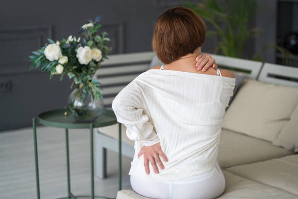 istock Back pain, kidney inflammation, woman suffering from backache at home 1496128363