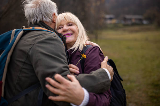 istock Senior couple hugging in nature 1496129031