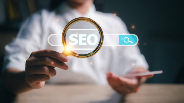 istock Women use magnifying glasses for analysis of SEO, and search engine optimization ranking traffic websites. internet business technology for promoting traffic to the website. 1496129614