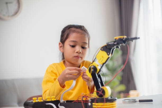 istock STEM education concept. Asian students learn at home by coding robot arms in STEM, mathematics engineering science technology computer code in robotics for kids' concepts. 1496130954
