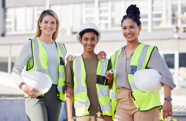 istock Architecture, women construction team and diversity in portrait, contractor group with smile at building site. Architect, engineering female with solidarity and trust in collaboration with builder 1496131183