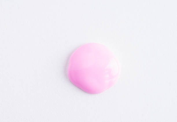 istock Pink cosmetic cream smear on white background. Face serum, lotion, moisturizer on white. Light pink paint swatch. Skincare product macro. 1496133770
