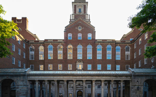 istock Old architecturally interesting red brick government building with the sun rising behind it 1496133784